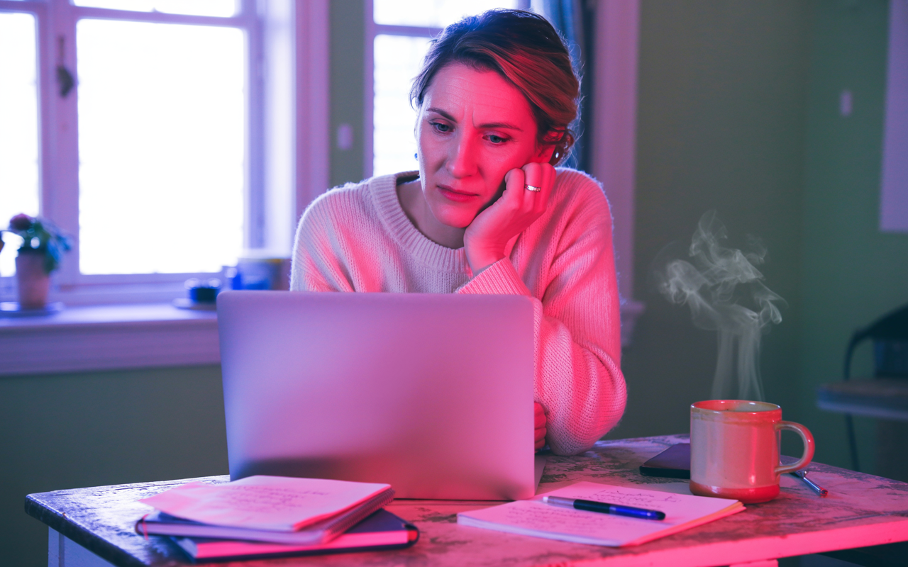Person looking reassured after reaching out to their Mounjaro provider on the phone for support