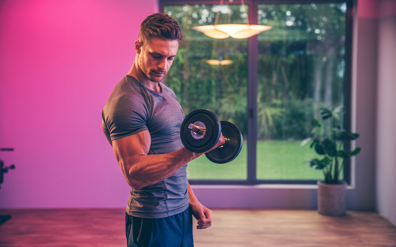 Man exercising at the gym, representing the lifestyle component of weight management
